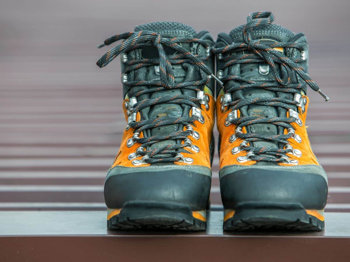 New hiking boots placed indoors, ready to be worn around the house as the first step in learning how to break in hiking boots.